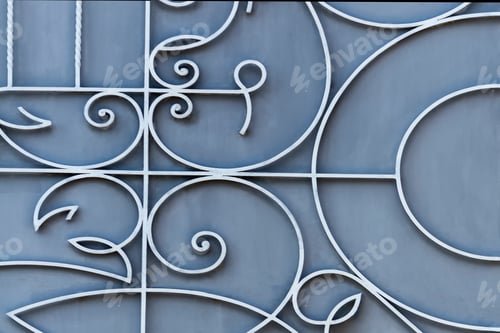 Preview: Decorative metal twisted fence. Sunny summer day. Front view.