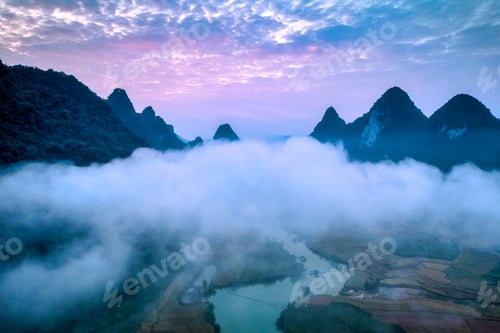 Preview: Sunrise sky over mountain with foggy on winding river in countryside at Phong Nam Valley
