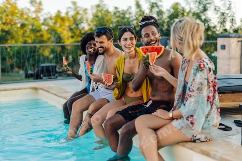 Preview: Friends eating watermelon by the poolside during summer vacation