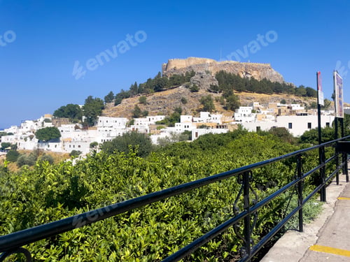 Preview: Lindos town on the Greek island of Rhodes on a bright summer day with clear blue sky and no people