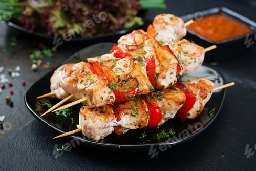 Preview: Chicken skewers with slices of sweet peppers and dill. Tasty food. Weekend meal.