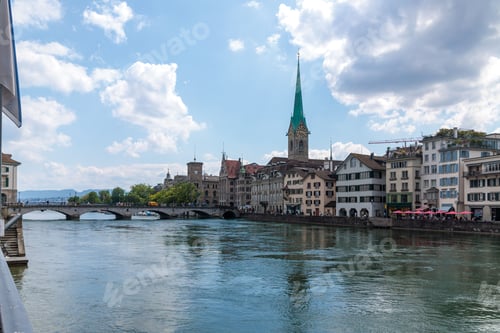 Preview: Scenic view of Zurich's historic center with Fraumunster Church and Limmat River