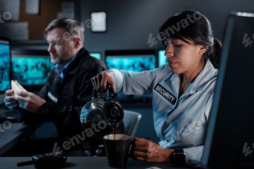 Preview: Guard with teapot pouring tea in mug