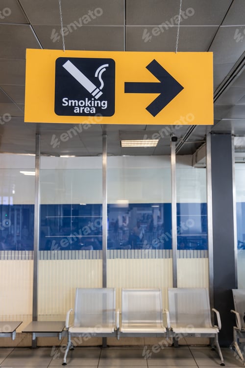 Preview: Direction signage to smoking area at airport terminal departure hall