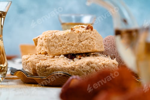 Preview: Turkish halva with tea in a glass cup close up