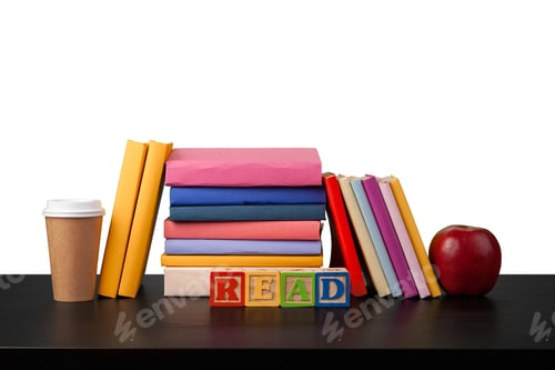 Preview: Stack of books and apple on tabletop against white background