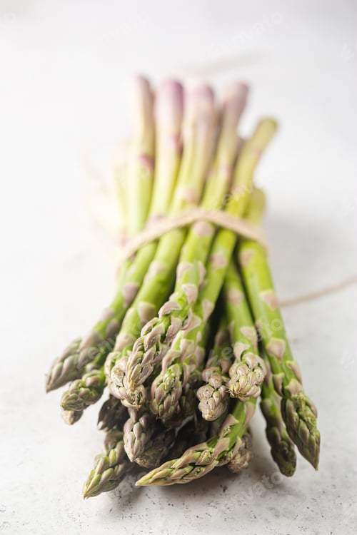 Preview: Bunch of fresh green asparagus spears on a rustic background