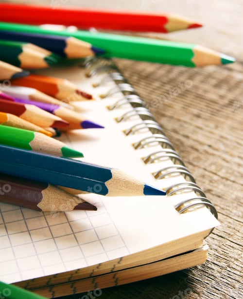 Preview: School tools. On wooden background.