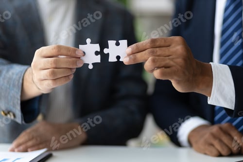 Preview: People hand holding puzzles to connect, Teamwork of people in the organization. Jigsaw