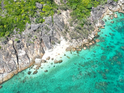 Preview: Drone view of the Fitzroy Island surrounded by the sea on a sunny day in Australia