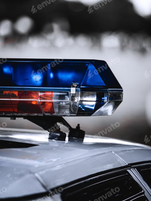 Preview: Vertical closeup of a police car emergency light siren