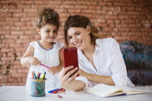 Preview: Woman and Child Enjoying Video Call at Home