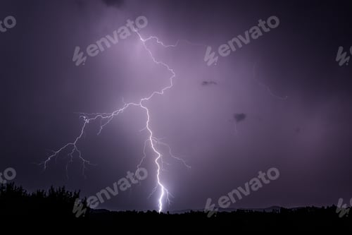 Preview: Powerful lightning strike in a bright purple sky