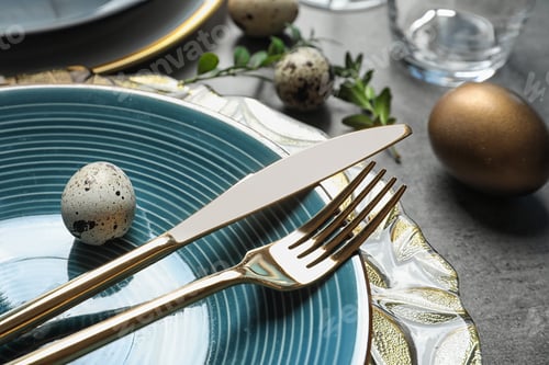Preview: Festive Easter table setting with eggs on color background, closeup