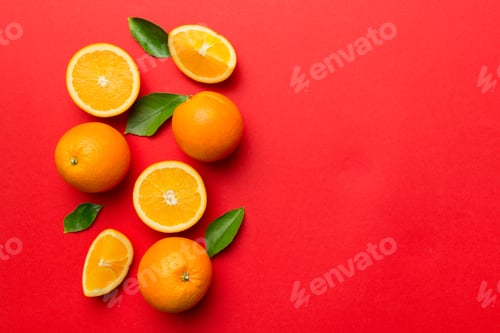 Preview: fresh Fruit orange slices on colored background. Top view. Copy Space. creative summer