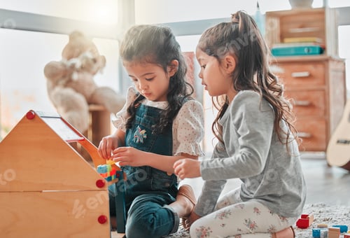 Preview: Two Girls Play Building Together at Home