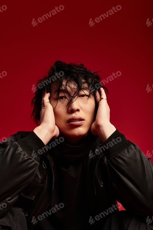 Preview: Young Asian man poses in studio, modern allure
