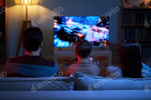 Preview: Child Playing Video Game With Parents