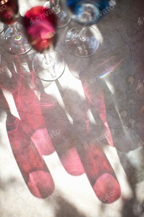 Preview: Shadow of wine and water glasses