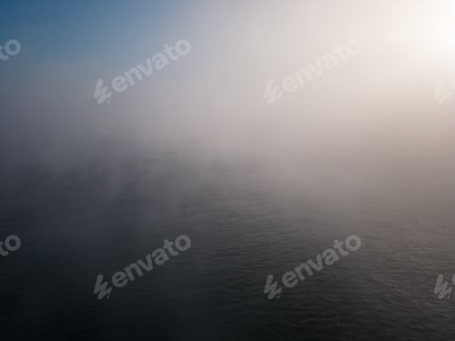 Preview: drone flight over the sea in the fog in the morning