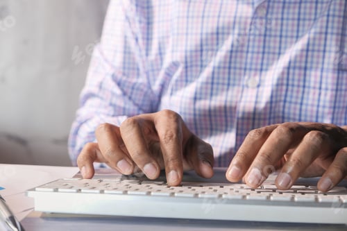 Preview: young man typing on keyboard in office
