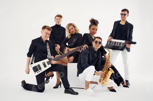 Preview: Portrait of diverse group of young people musical band playing with instruments - isolated on white