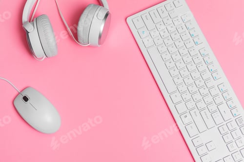 Preview: Woman's pink creative workspace with computer keyboard and supplies, top view