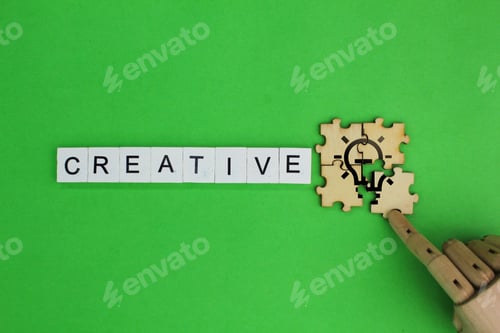 Preview: creative alphabet letters and puzzle with idea icon or light bulb.