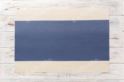 Preview: Top view of blue tablecloth for food on wooden background. Empty space for your design