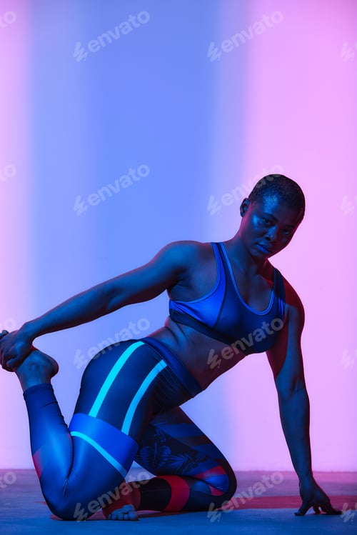 Preview: Body positive, slimming. African american woman in sportswear workout, fashion studio shot