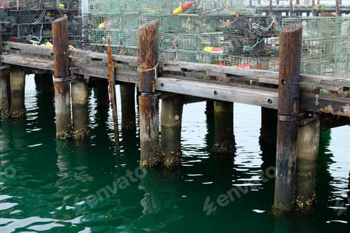 Preview: Old wooden pier with a lot of metal cages