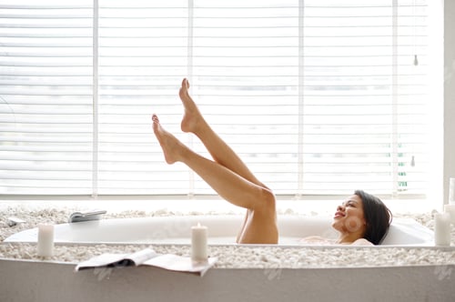 Preview: Beautiful woman, skincare in bath with milk