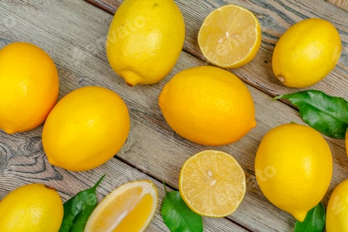 Preview: fresh lemons on wooden table. Creative photo