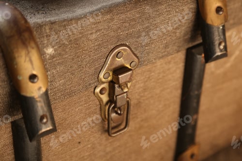 Preview: A lock on a vintage suitcase.