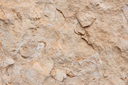 Preview: Natural stone background detail in warm tone. Textured rock