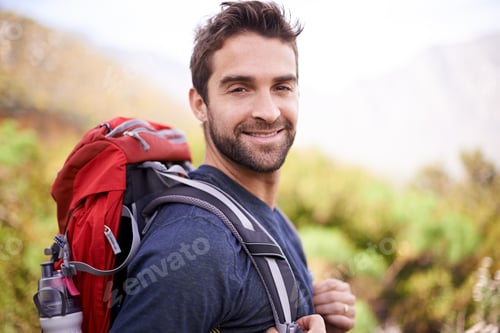 Preview: Hikers are happiest. Shot of a young man enjoying a hike through the mountains.