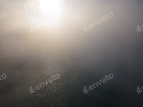Preview: drone flight over the sea in the fog in the morning