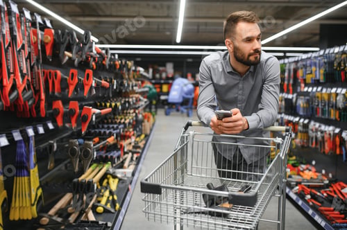 Preview: male builder in a hardware store