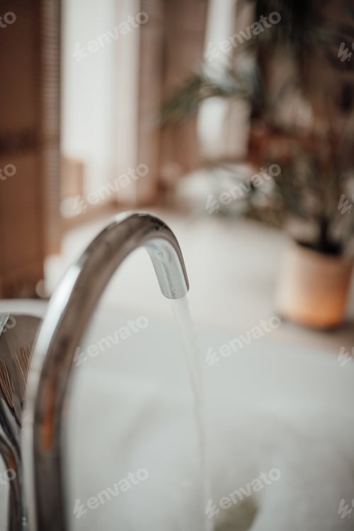 Preview: Luxury interior of big bathroom at modern african style with oval bathtub in natural lighting