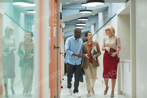 Preview: Colleagues talking at office