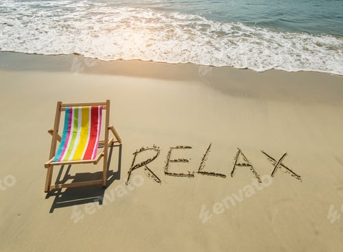 Preview: Deck Chair With Relax Written In Sand Write On Tropical Beach.