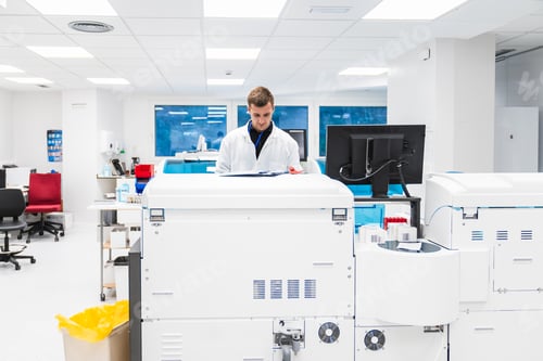 Preview: Male Laboratory Technician Reviewing Results on Clinical Equipment