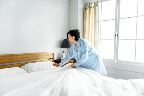 Preview: A woman making bed