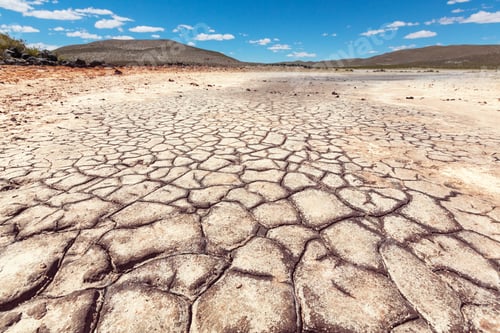 Preview: Cracked Earth and Landscape Under a Sunny Sky