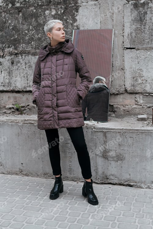 Preview: Stylish And Beautiful Girl With Short Hair On The Street Near The Concrete Wall