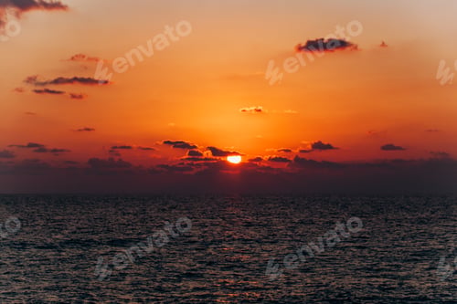 Preview: Beautiful sunset over the sea. Reflection of sunset in the sea. Orange sunset.