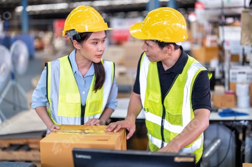 Preview: Staff working in large depot storage warehouse trainee check packing box and scan at cashier counter