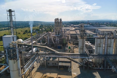 Preview: Aerial view of oil and gas refining petrochemical factory with tall refinery plant manufacture