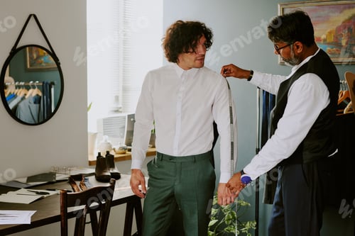 Preview: Man Being Fitted for Custom Tailored Suit