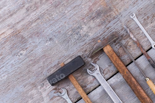 Preview: Carpentry and constrution tools on wooden background.